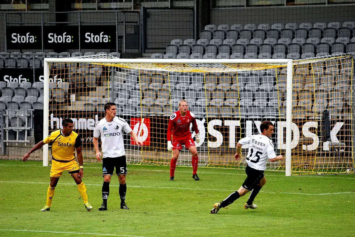 Football players and goalkeeper near goal at Casa Arena Horsens