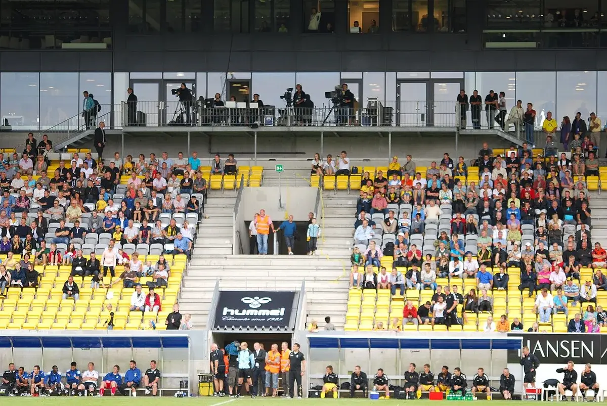 Exterior view of CASA Arena Horsens with spectators in the stands.