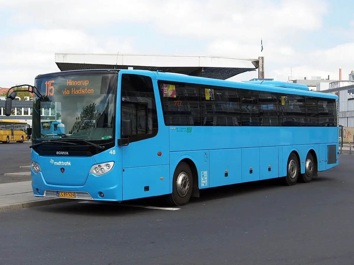 Blue Scania Midttrafik bus at a bus station in Randers