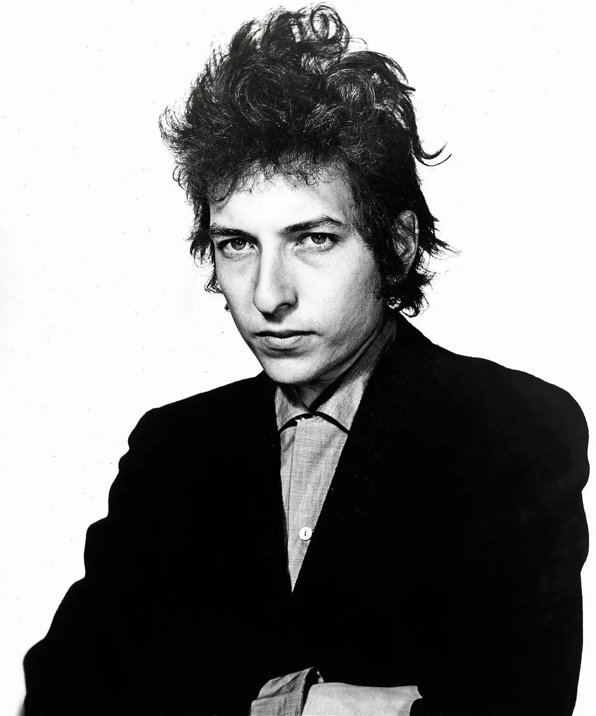 Black-and-white portrait of Bob Dylan against a plain background.